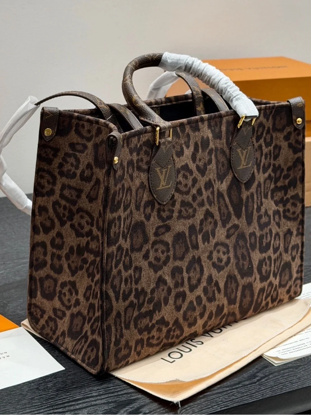 Louis Vuitton Leopard-Print Tote in Brown